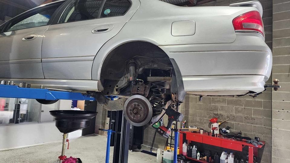 Donnellys Mechanical - Port Macquarie. A picture of a customer's vehicle being worked by Mechanics in Port Macquarie.