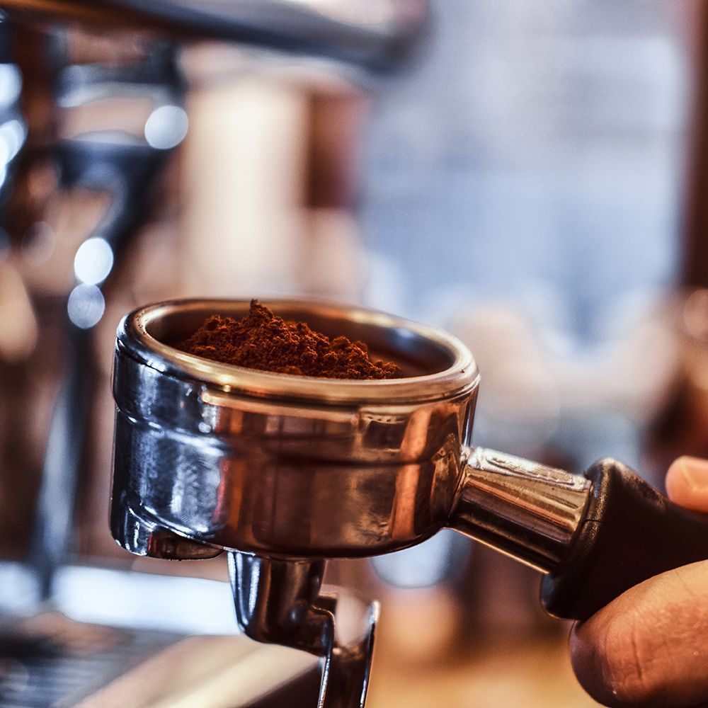 Barista preparing fresh coffee at Hollyhocks Café in Guisborough