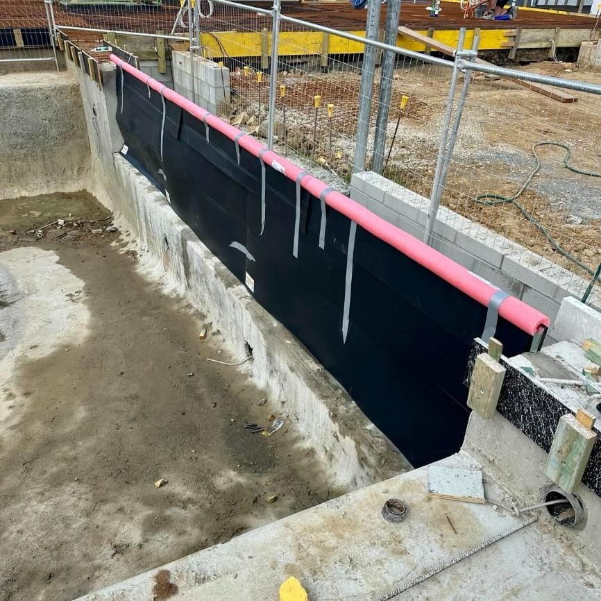 A Swimming Pool Is Being Built With A Fence Around It — Glass Pool Windows Australia In Sunshine Coast, QLD