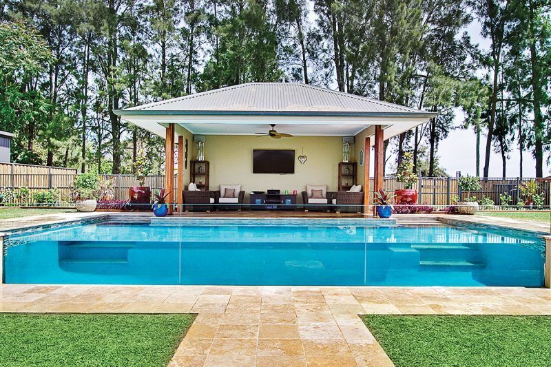 A Large Swimming Pool With A Gazebo In The Background — Glass Pool Windows Australia In Melbourne, VIC