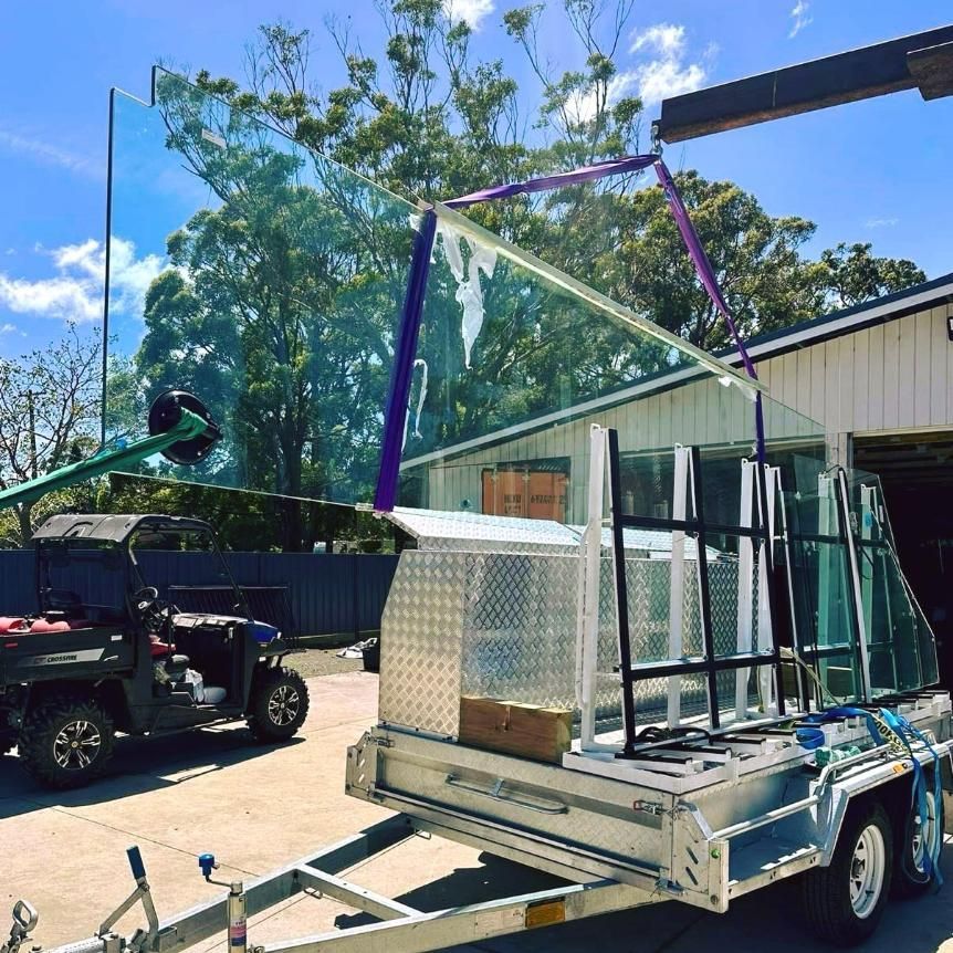 A Trailer With A Large Piece Of Glass On It — Glass Pool Windows Australia In Newcastle, NSW