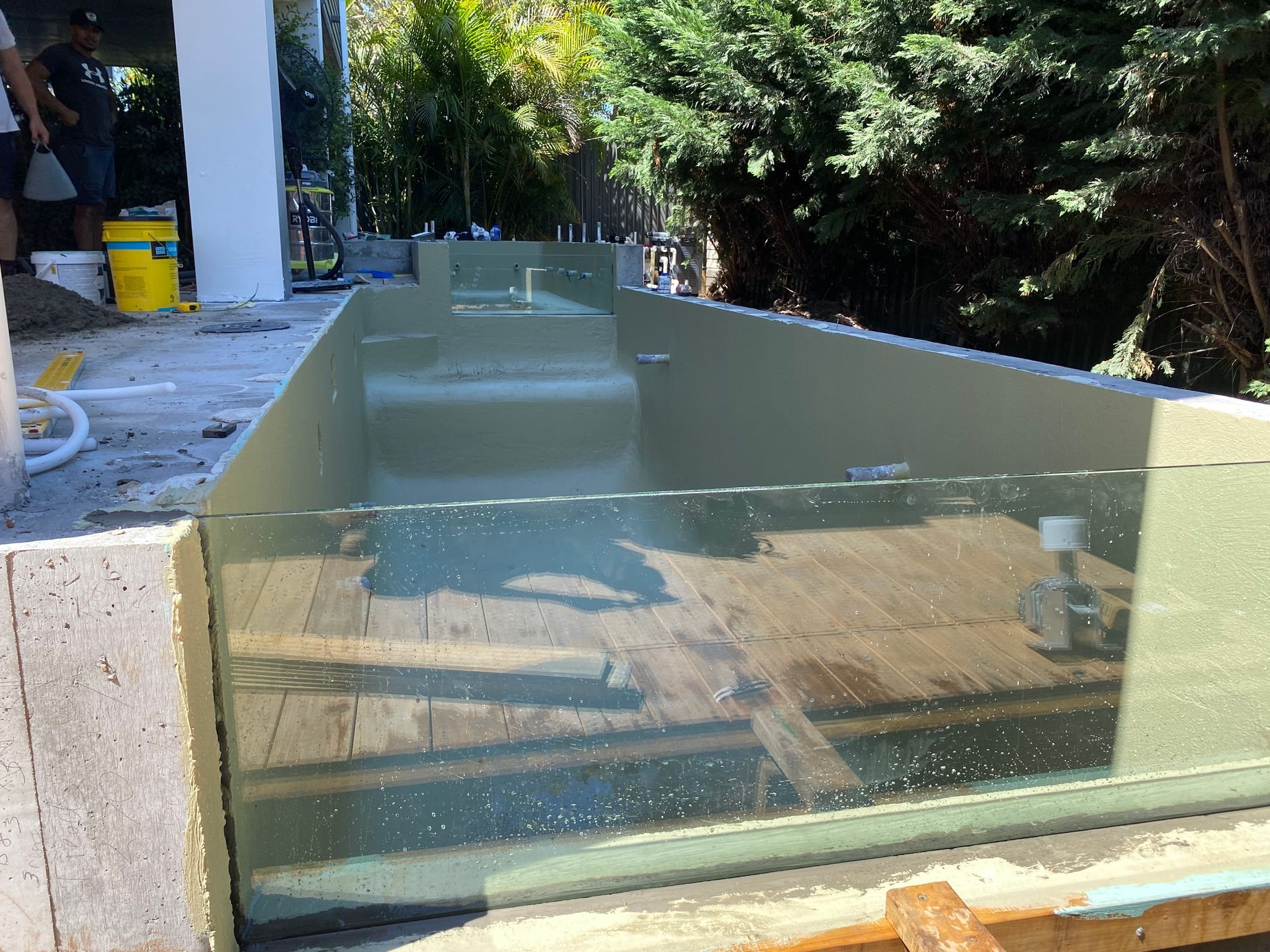 A Large Swimming Pool Is Being Built In A Backyard — Glass Pool Windows Australia In Old Bar, NSW