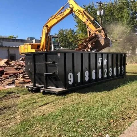 Yellow Excavator with Black Roll-Off Dumpster — Oktaha, OK — Five Star Roll-Offs Services