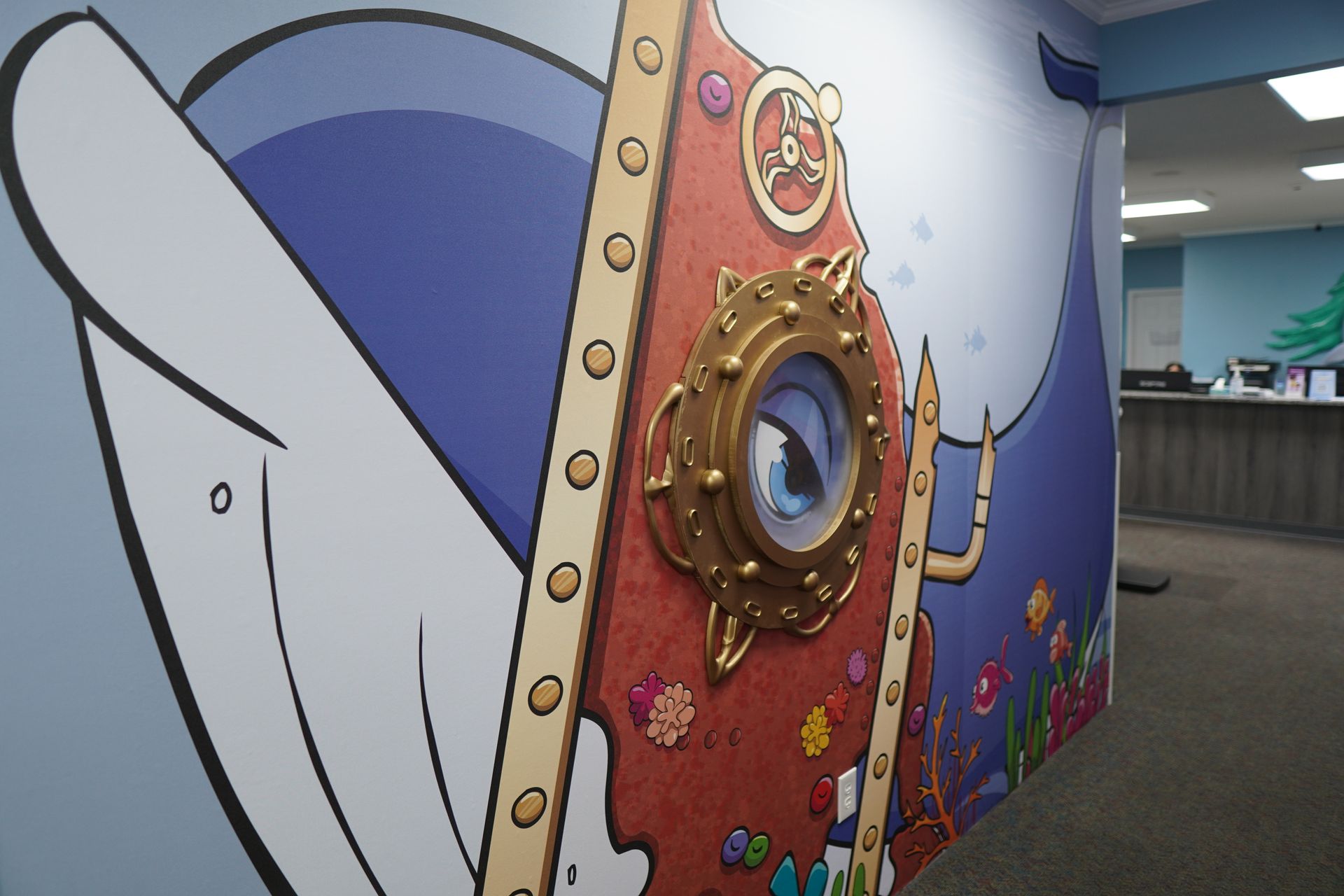 A wall with a picture of a dolphin on it