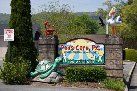 A sign that says peds care p.c. on it