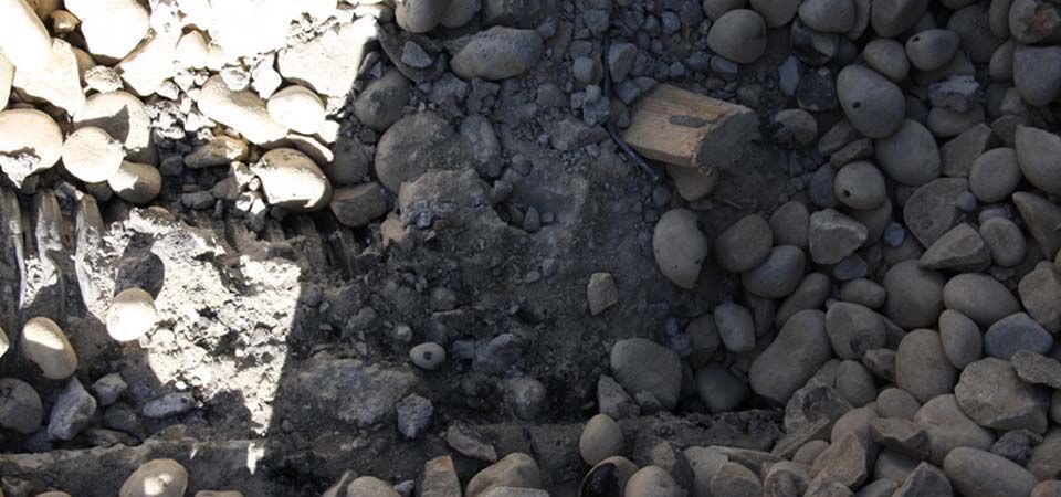 white and black pebbles covered in the shade