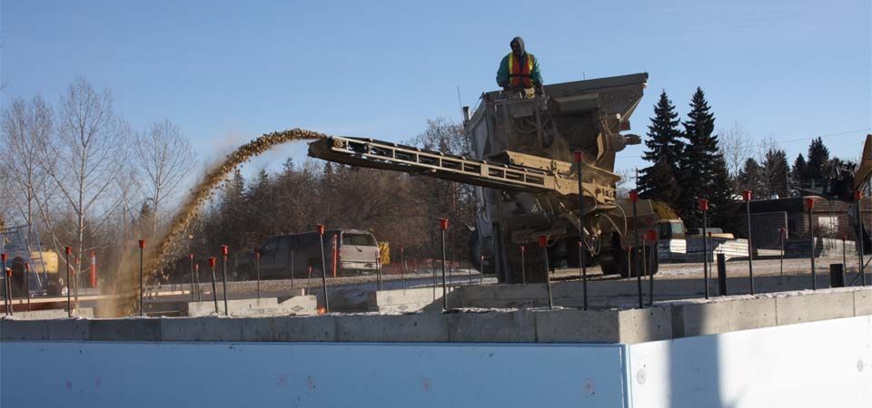 dirt being poured for landscape job