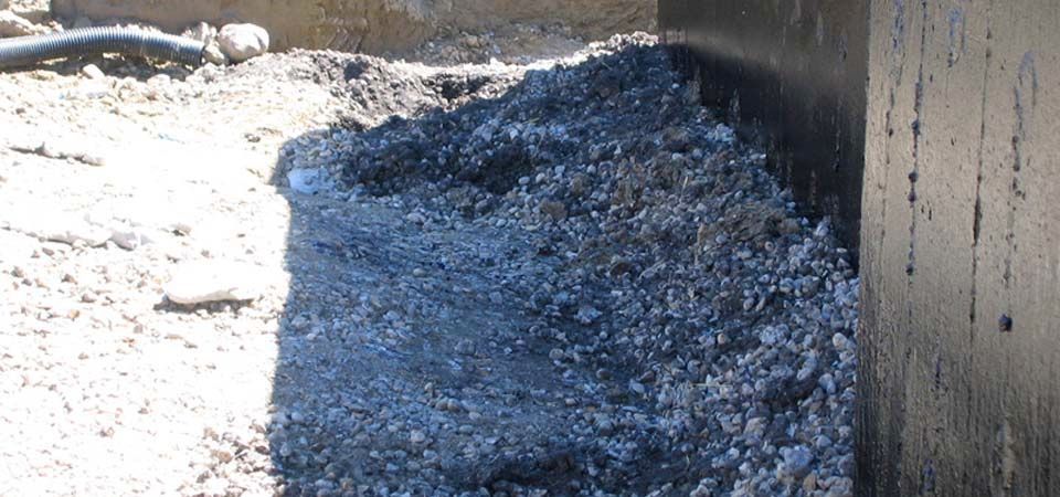 gravel and pebble pile covered in shade