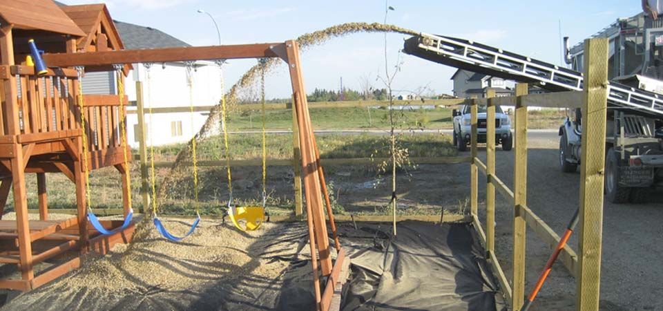 dirt pouring for swingset installation and set up