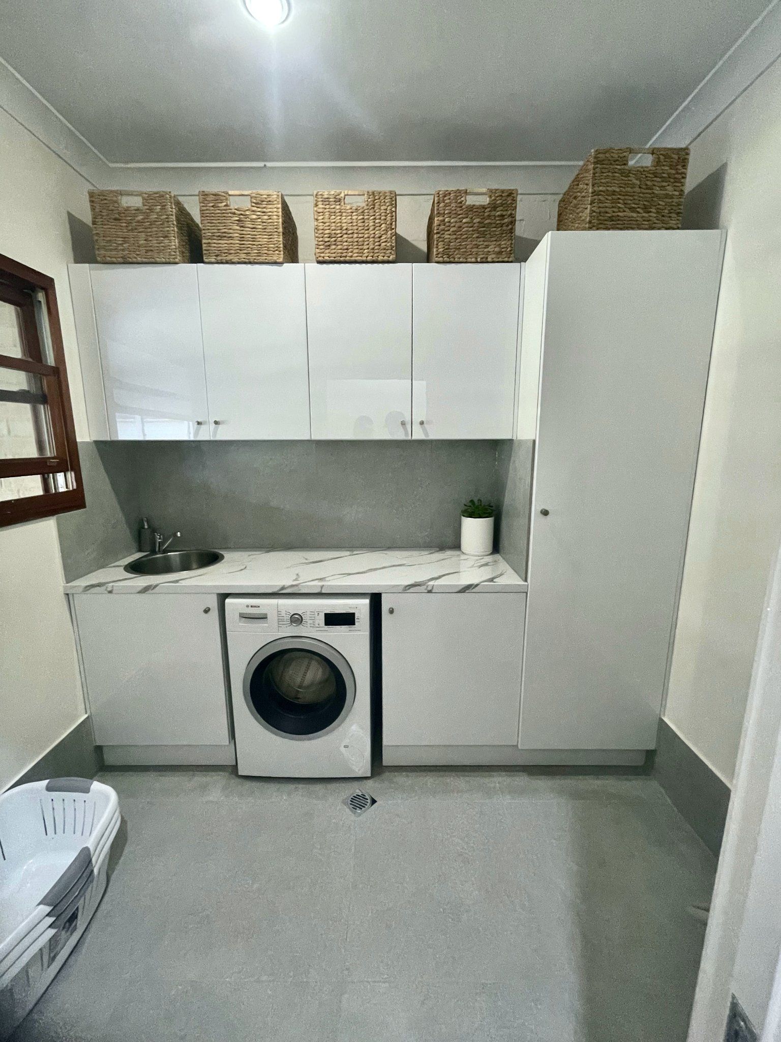 Laundry Room With White Cabinets, Washing Machine — Edmonds Bathroom Renovations & Tiling In Lake Cathie, NSW