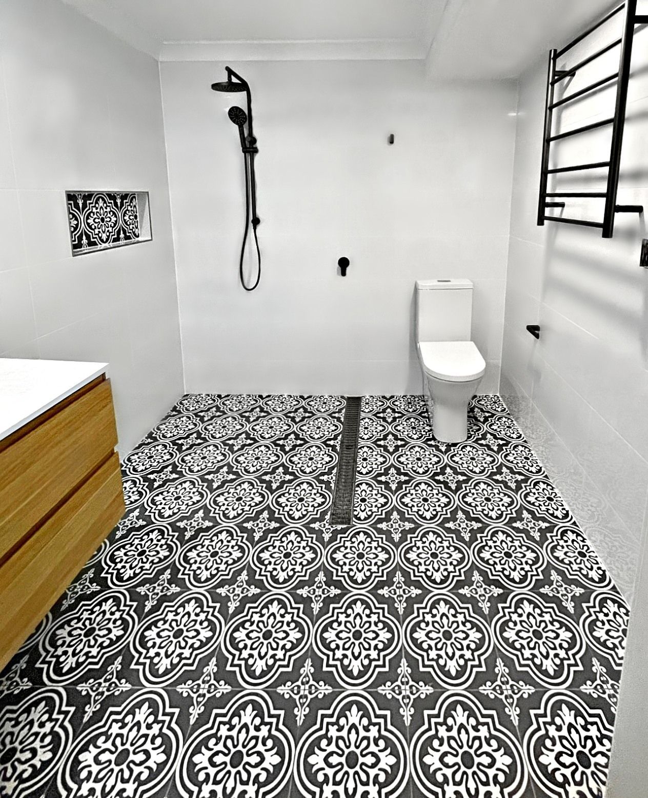 Bathroom With Black and White Patterned Floor Tiles— Edmonds Bathroom Renovations & Tiling In Port Macquarie, NSW
