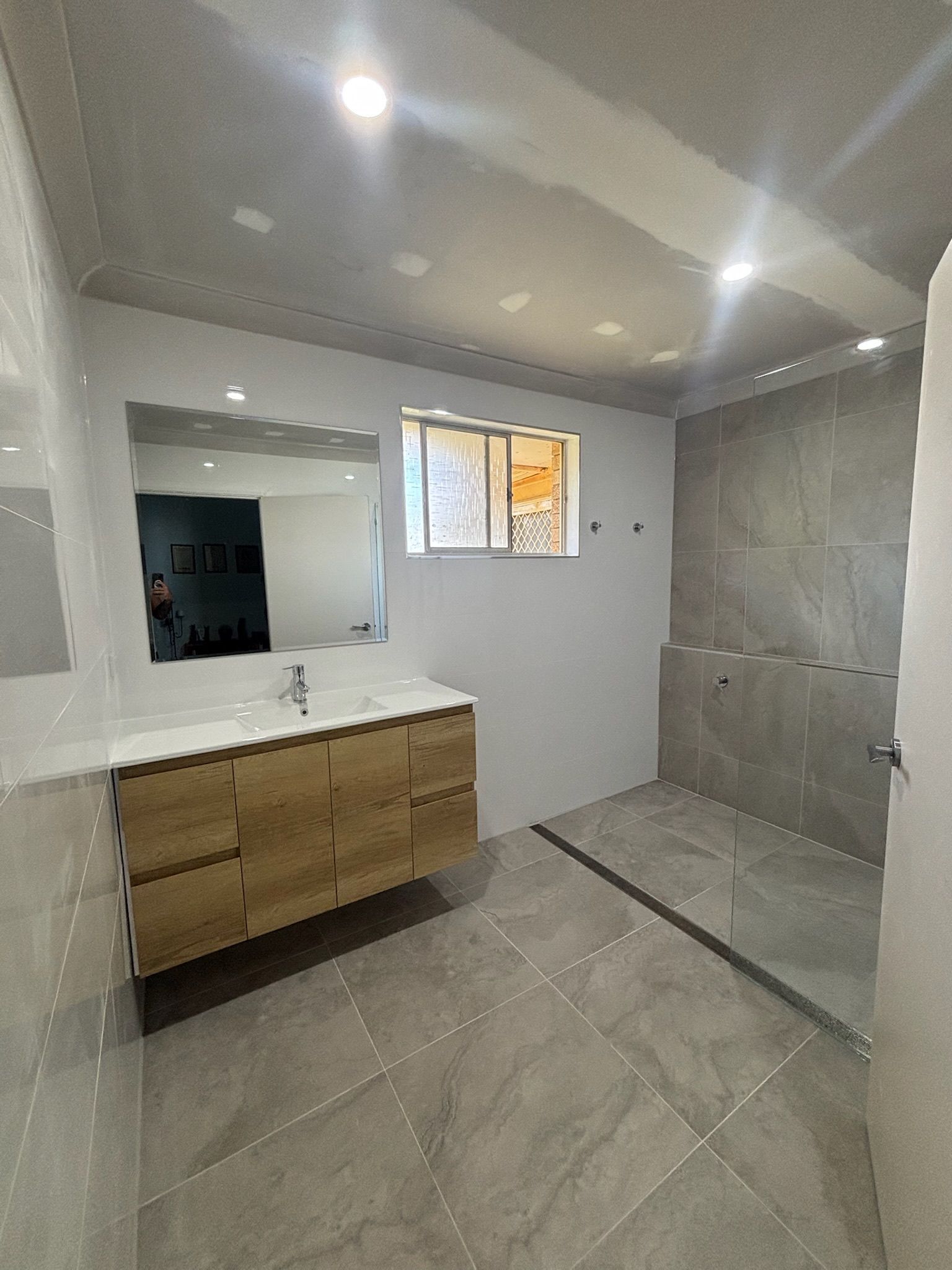 Modern Bathroom With Wood Vanity — Edmonds Bathroom Renovations & Tiling In Bonny Hills, NSW