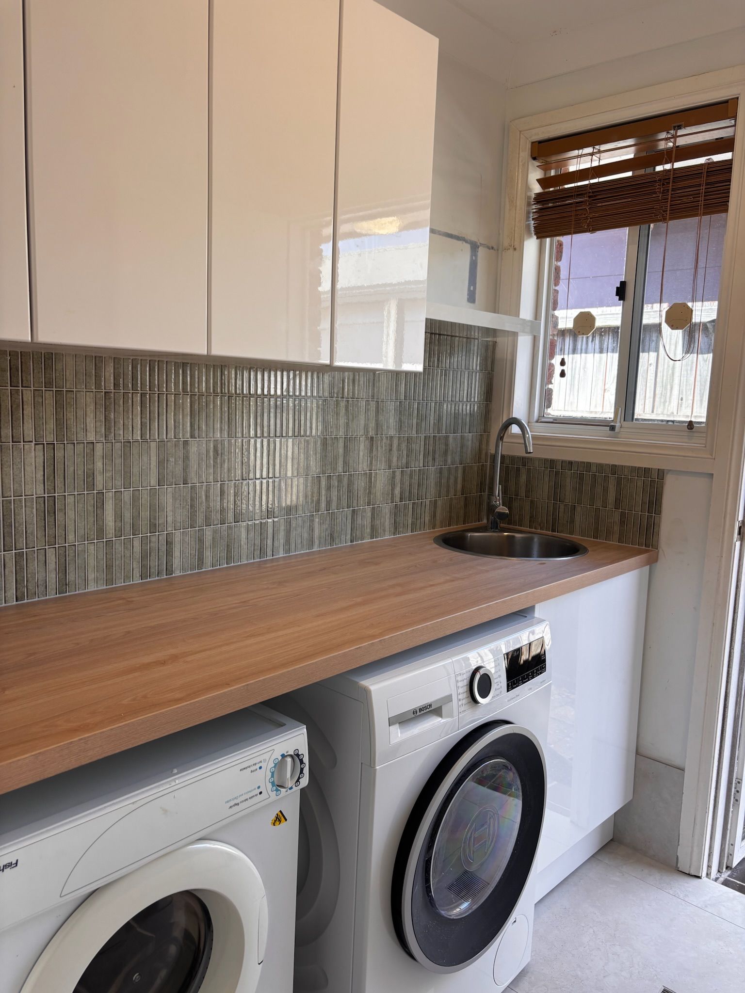 Laundry Room With Washer, Dryer, Wooden Countertop — Edmonds Bathroom Renovations & Tiling In Port Macquarie, NSW