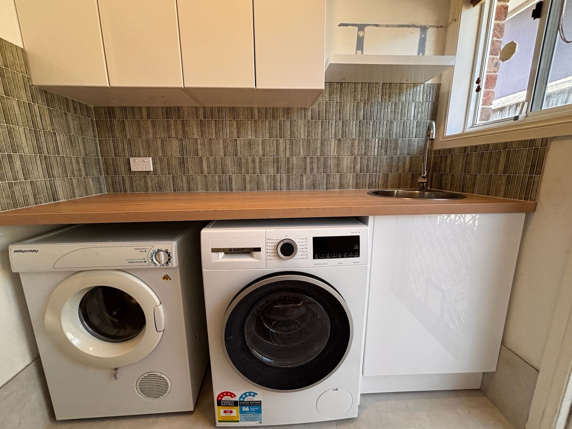 Laundry Room With Washer, Dryer, and Cabinetry — Edmonds Bathroom Renovations & Tiling In Port Macquarie, NSW