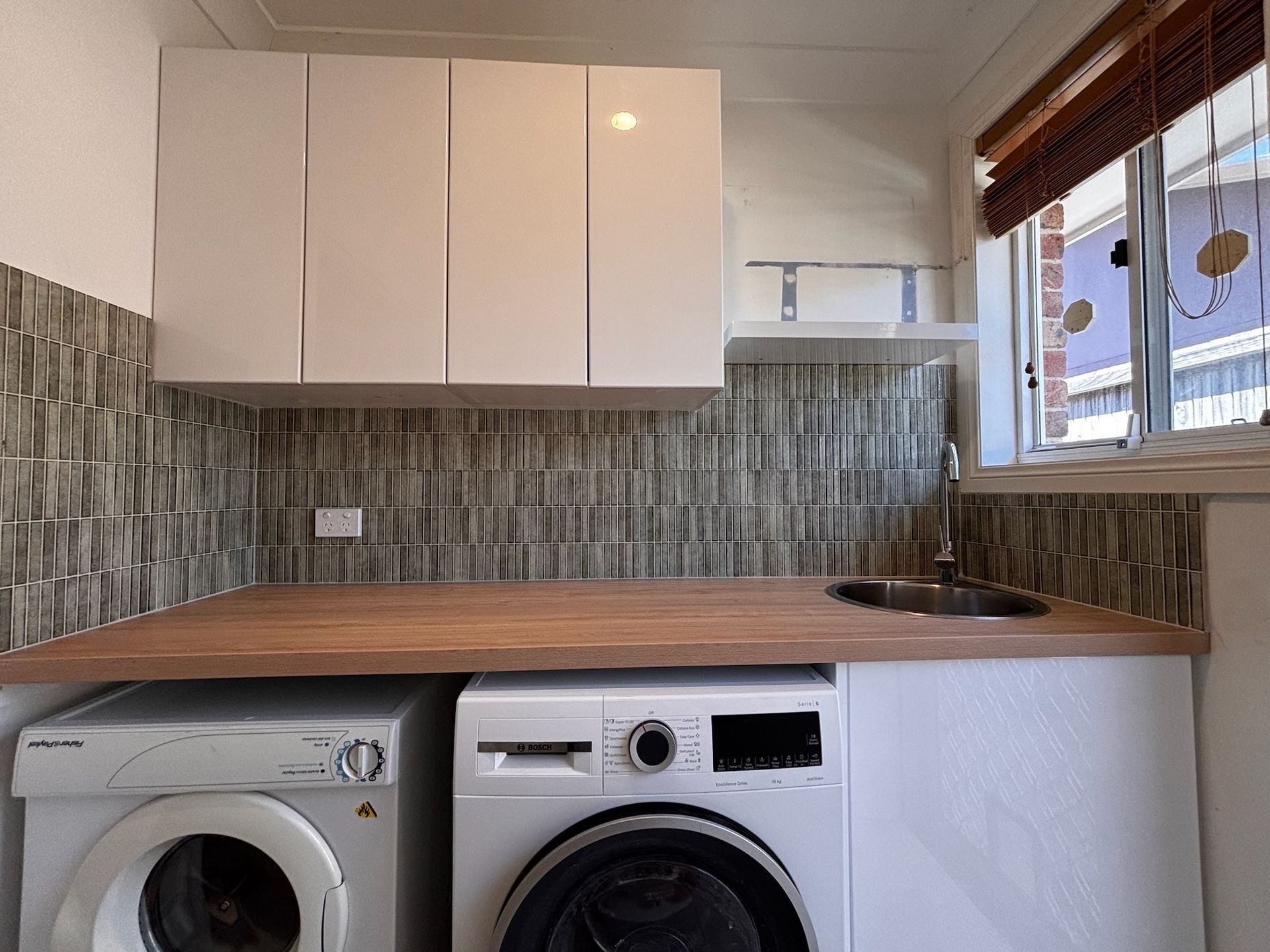 Laundry Room With White Cabinets — Edmonds Bathroom Renovations & Tiling In Thrumster, NSW