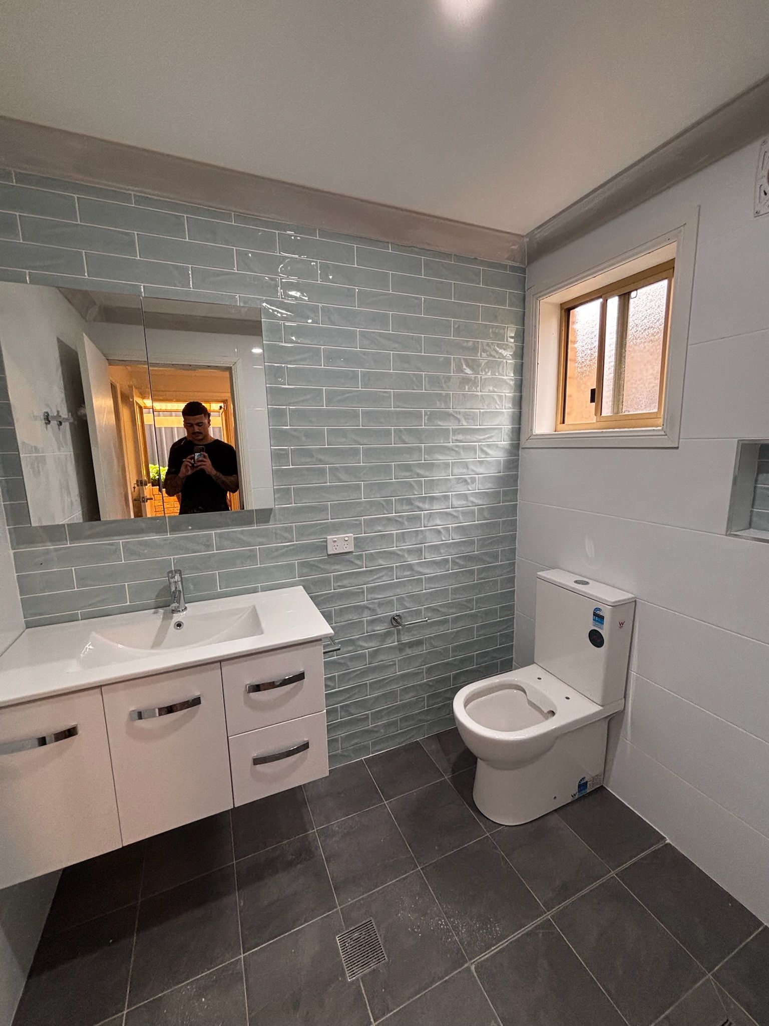 Modern Bathroom With Light Blue Textured Wall Tiles — Edmonds Bathroom Renovations & Tiling In Port Macquarie, NSW
