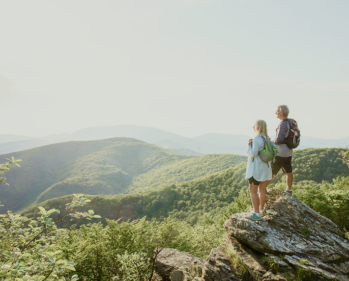 Couple hiking on a mountain.