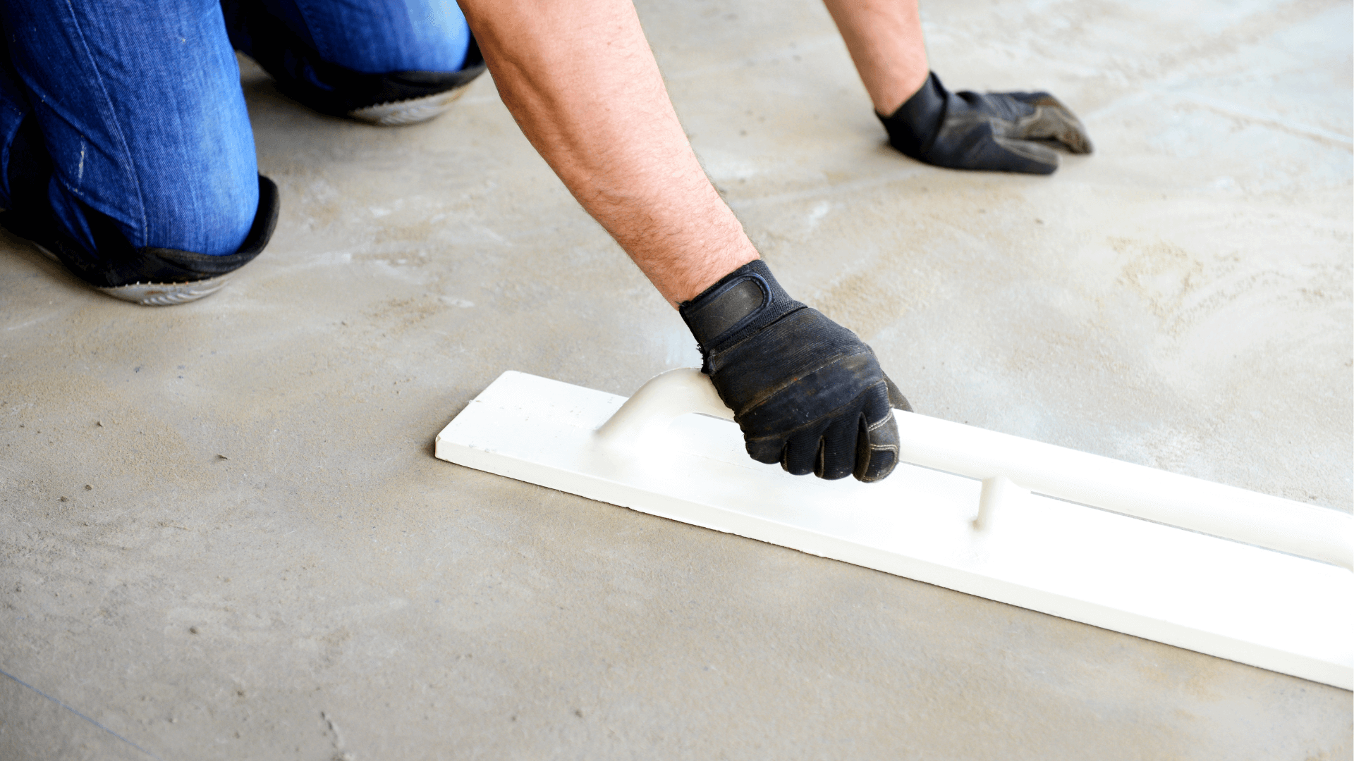 Wet concrete being smoothed by a professional concrete sidewalk company in Coon Rapids, MN