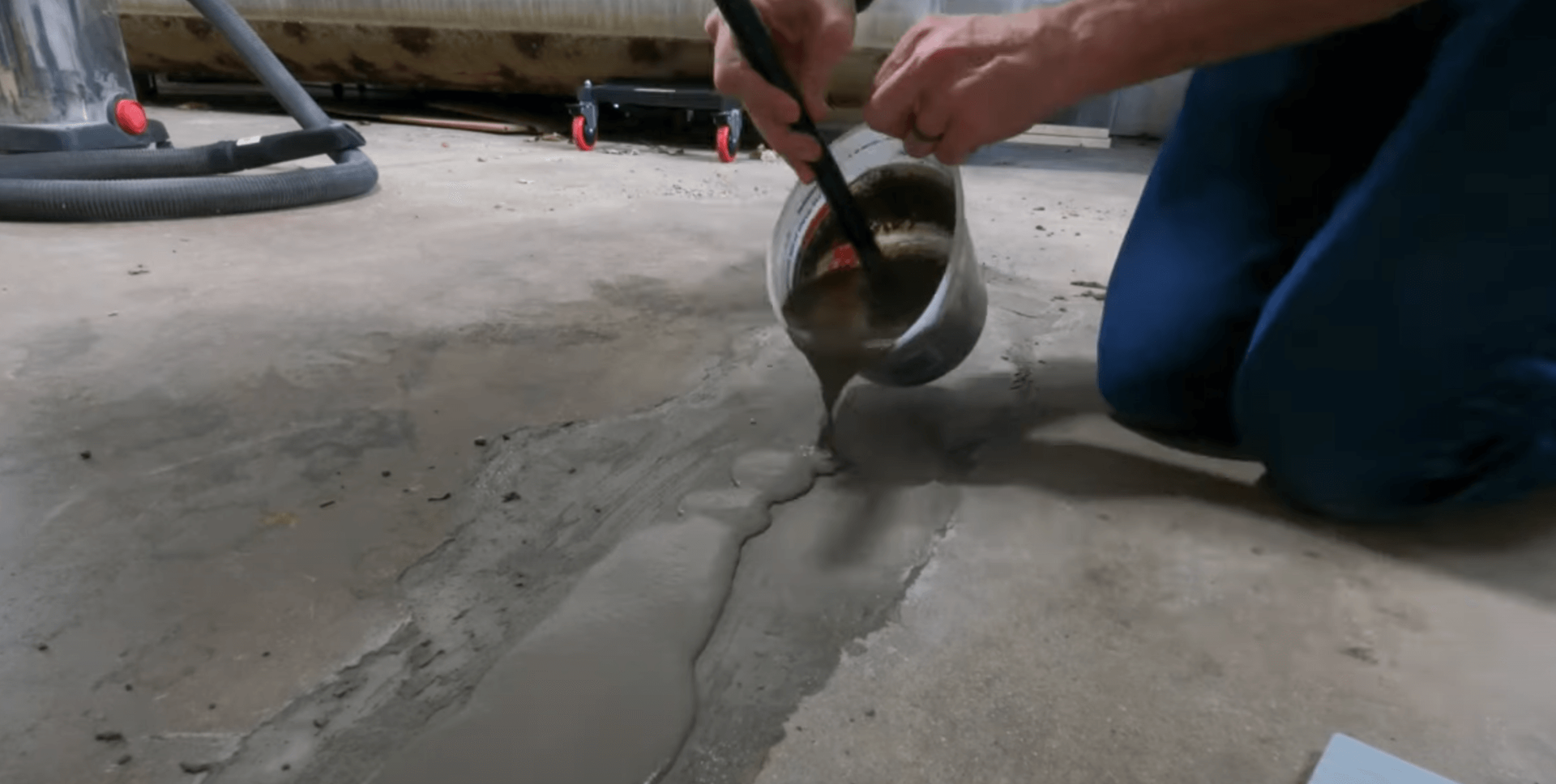 Cracked garage floor being repaired by a concrete contractor in coon rapids, MN