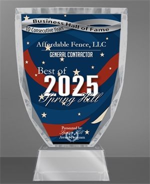 A crystal award for Affordable Fence, LLC, honoring them as the 2025 Best of Spring Hill Business Hall of Fame.