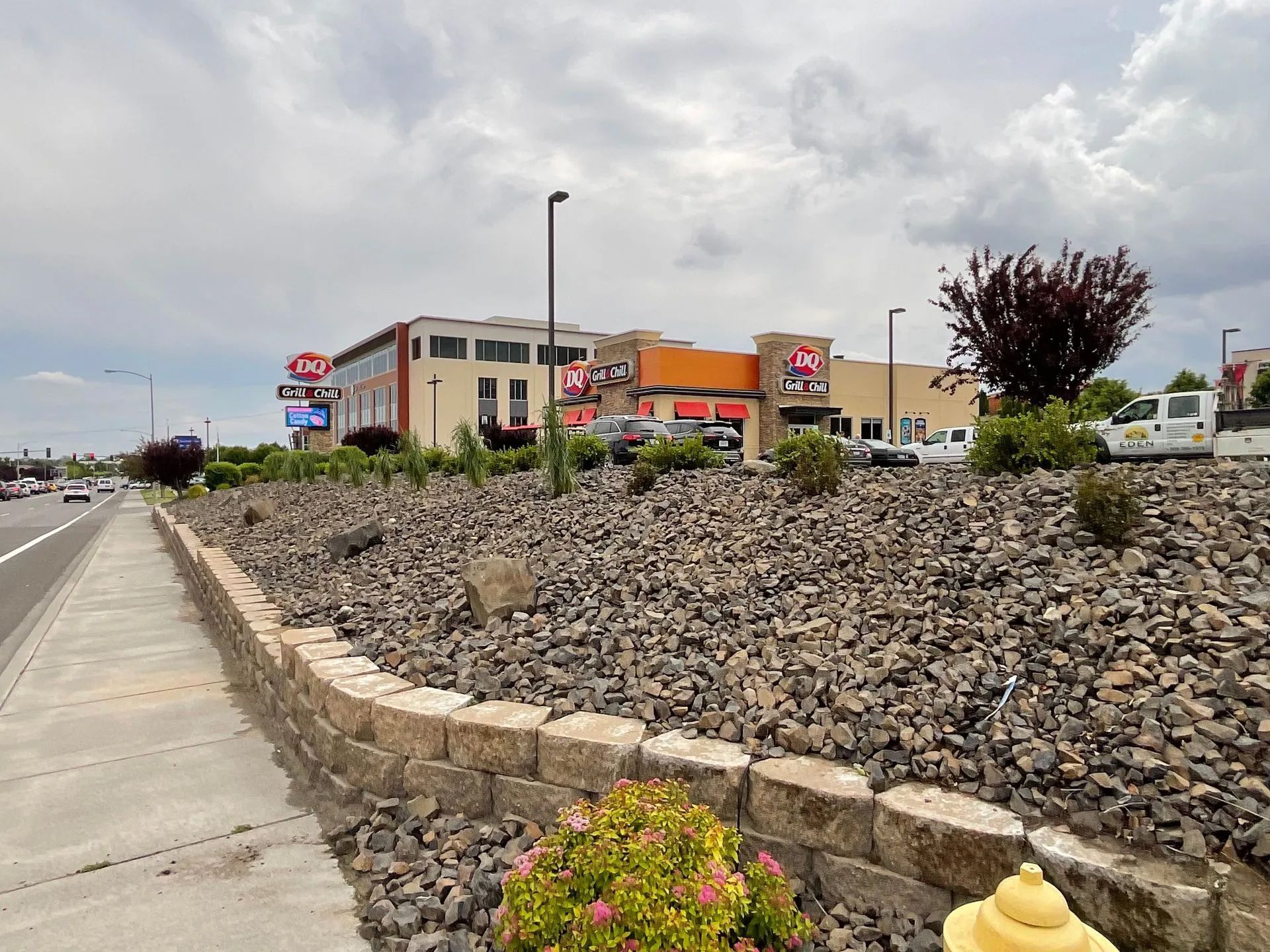 A fire hydrant is in front of a large building.