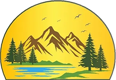 There are mountains and trees in the background and a lake in the foreground.