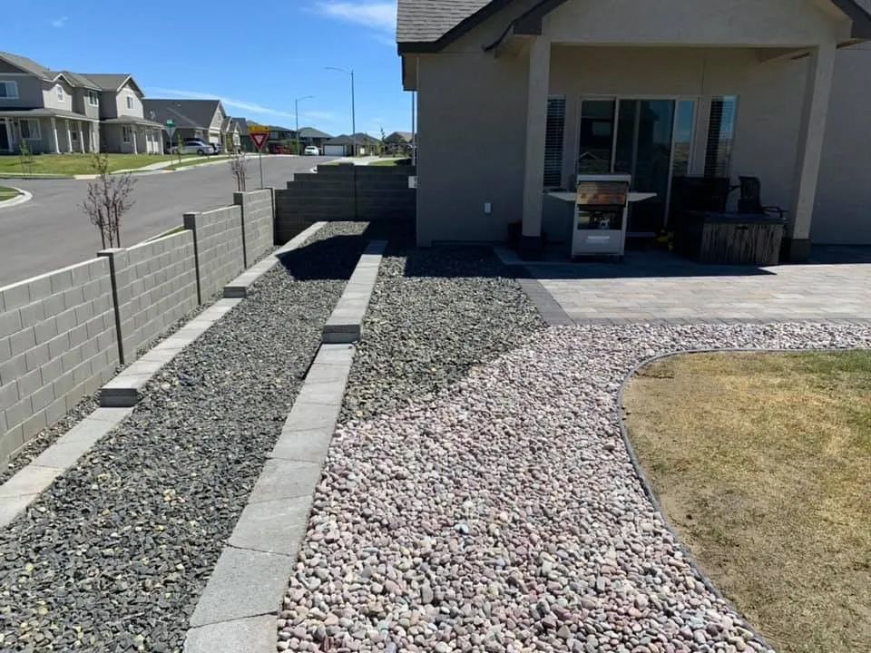 A gravel path leading to a house in a residential area