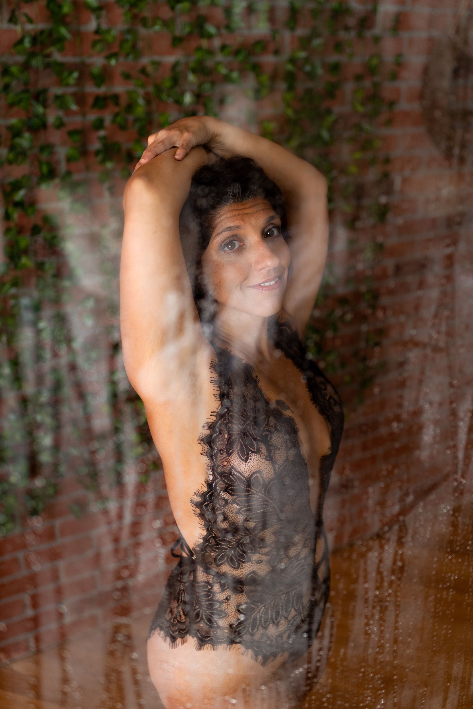 Close-up image of a woman's breast during a boudoir session