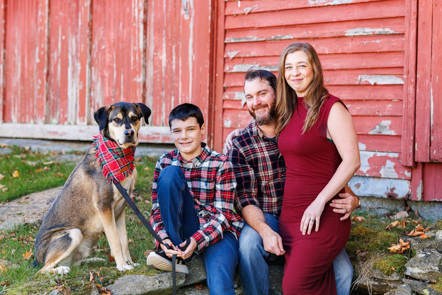 Family Photography with a mother, father, son and daughter walking hand in hand down a path.