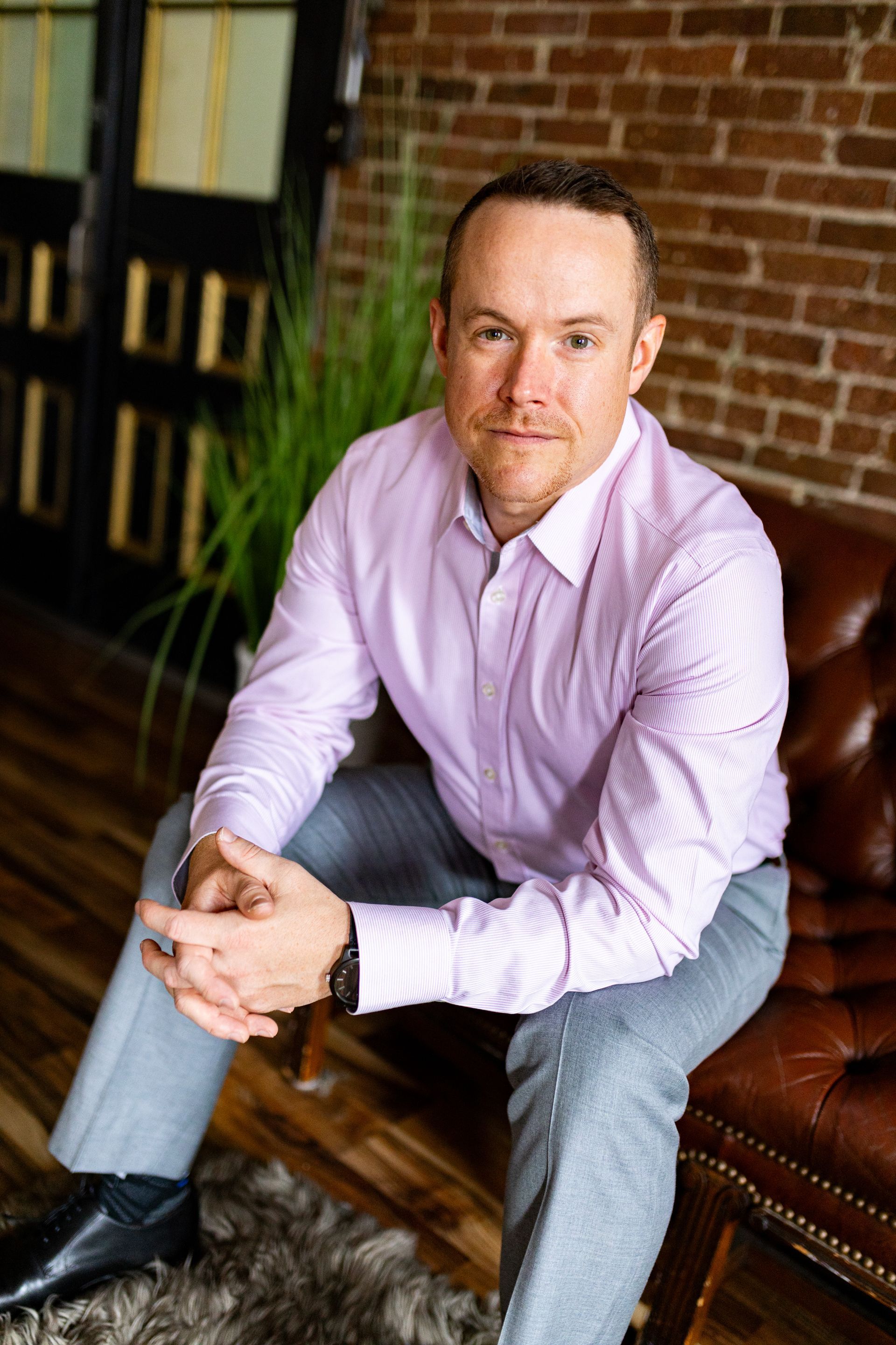 Business portrait man in a light purple business shirt