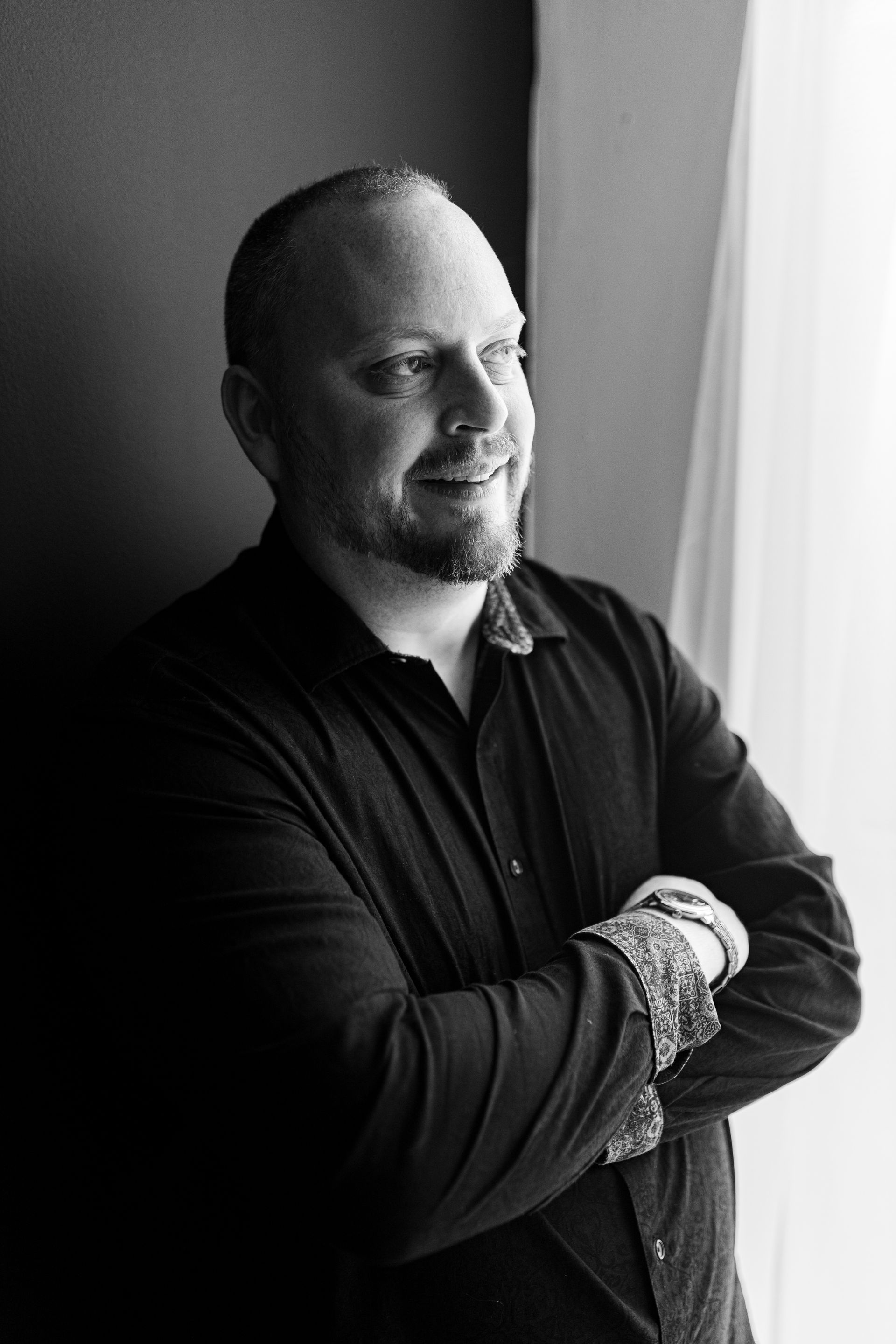 Business portrait man in a button up black and white
