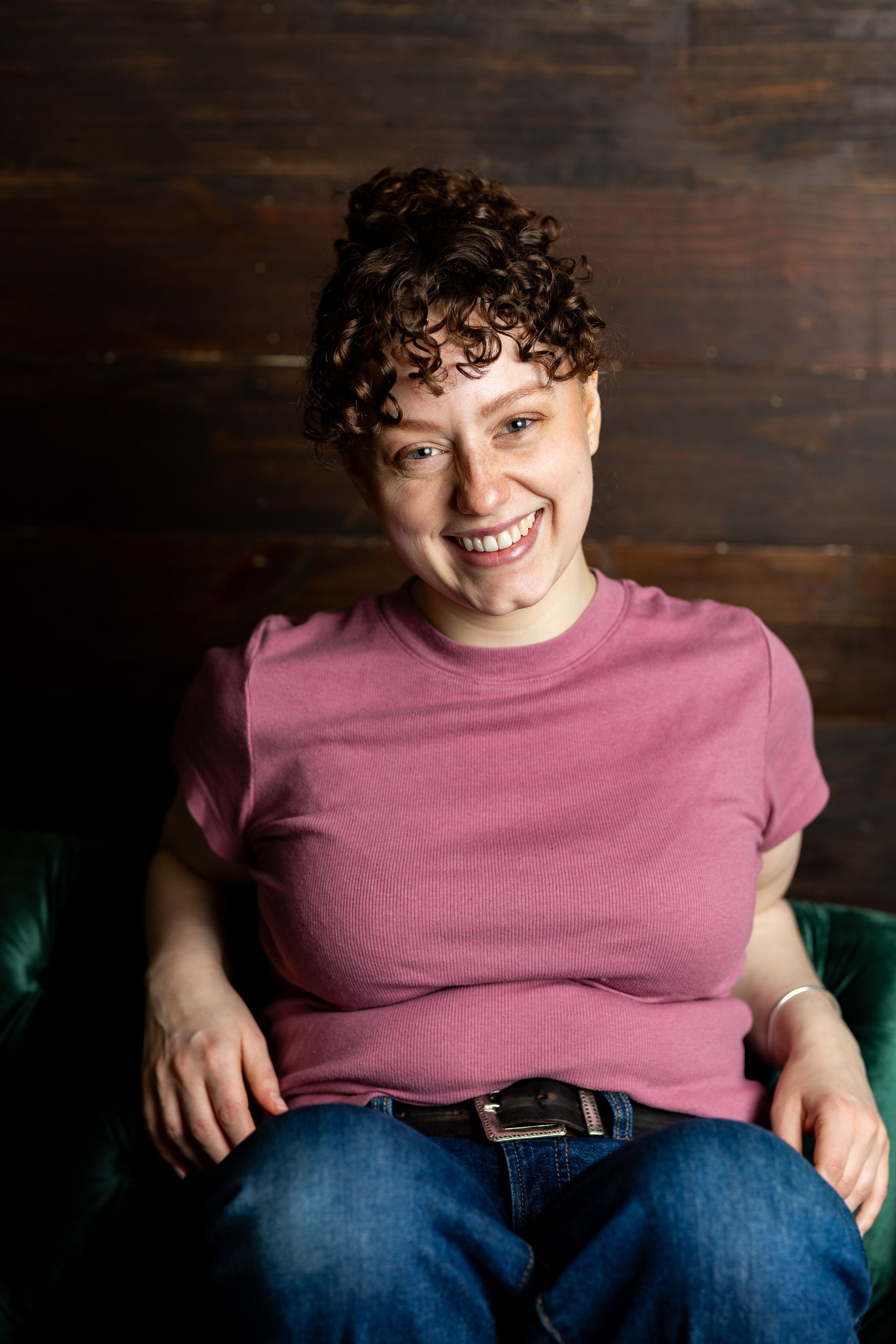 Business portrait - woman in a pink shirt smiling