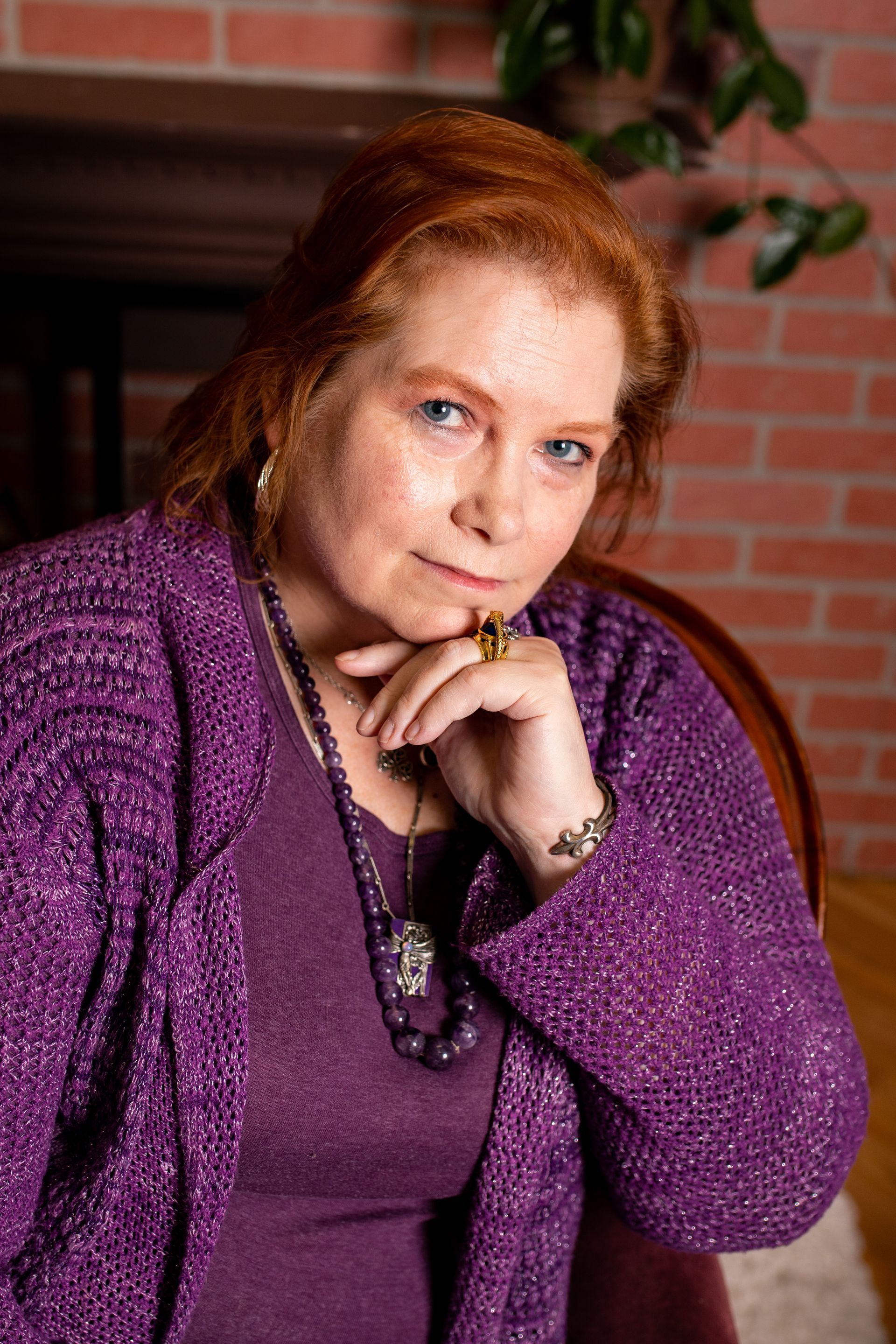 Business portrait - woman wearing a purple shirt