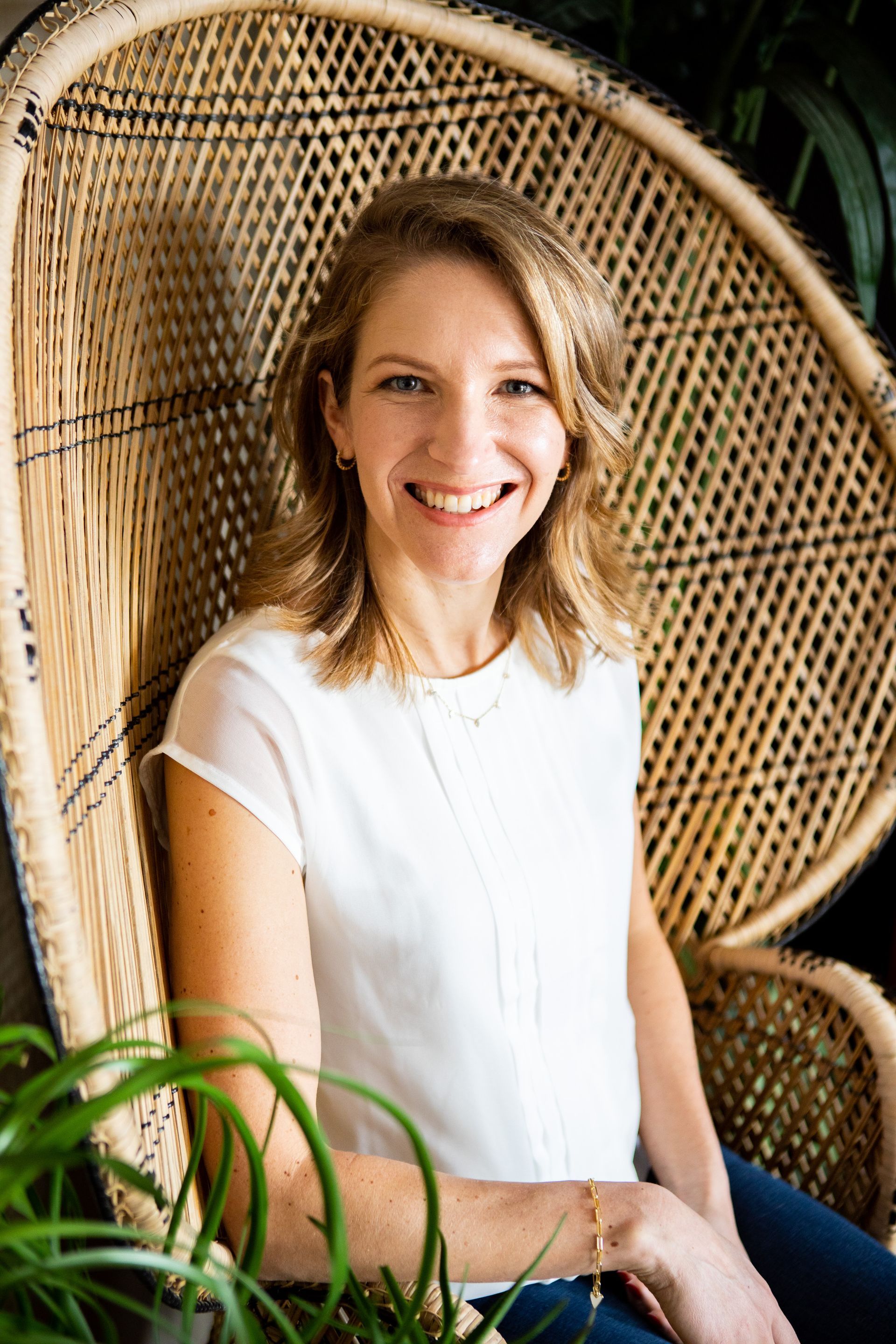 blonde woman in a white blouse
