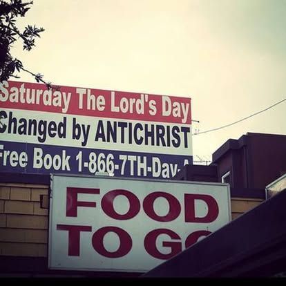 A sign that says food to go on it