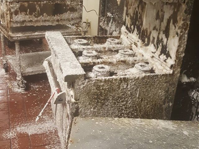 Snow-covered industrial machinery in a weathered outdoor area