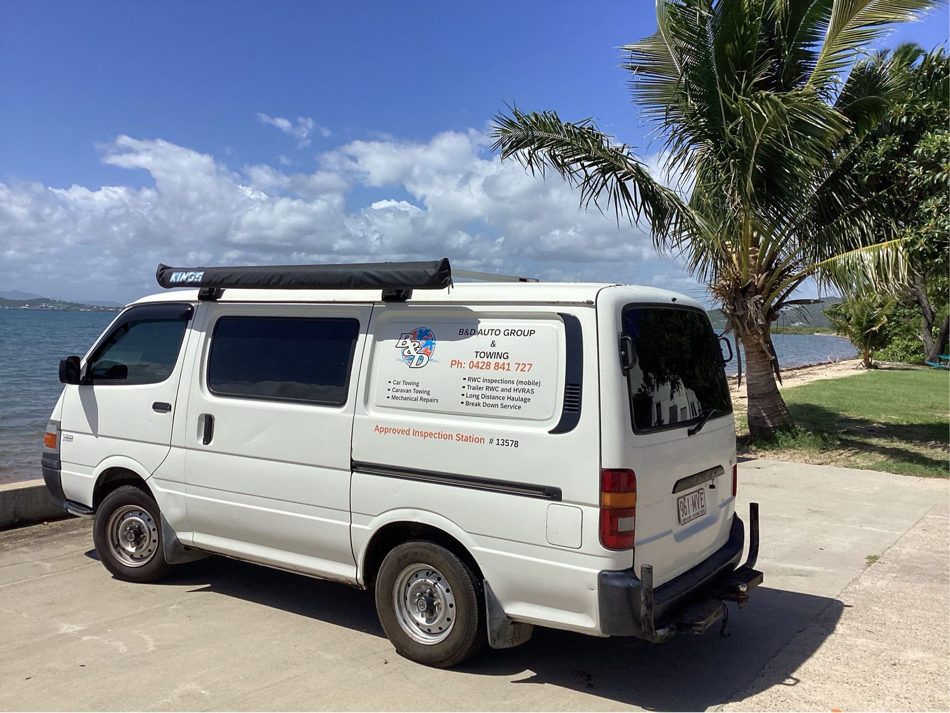 Tow Truck Loaded With a Vehicle at Night, Parked on a Gravel Area Near Trees — B&D Auto Group & Towing in Ayr, QLD
