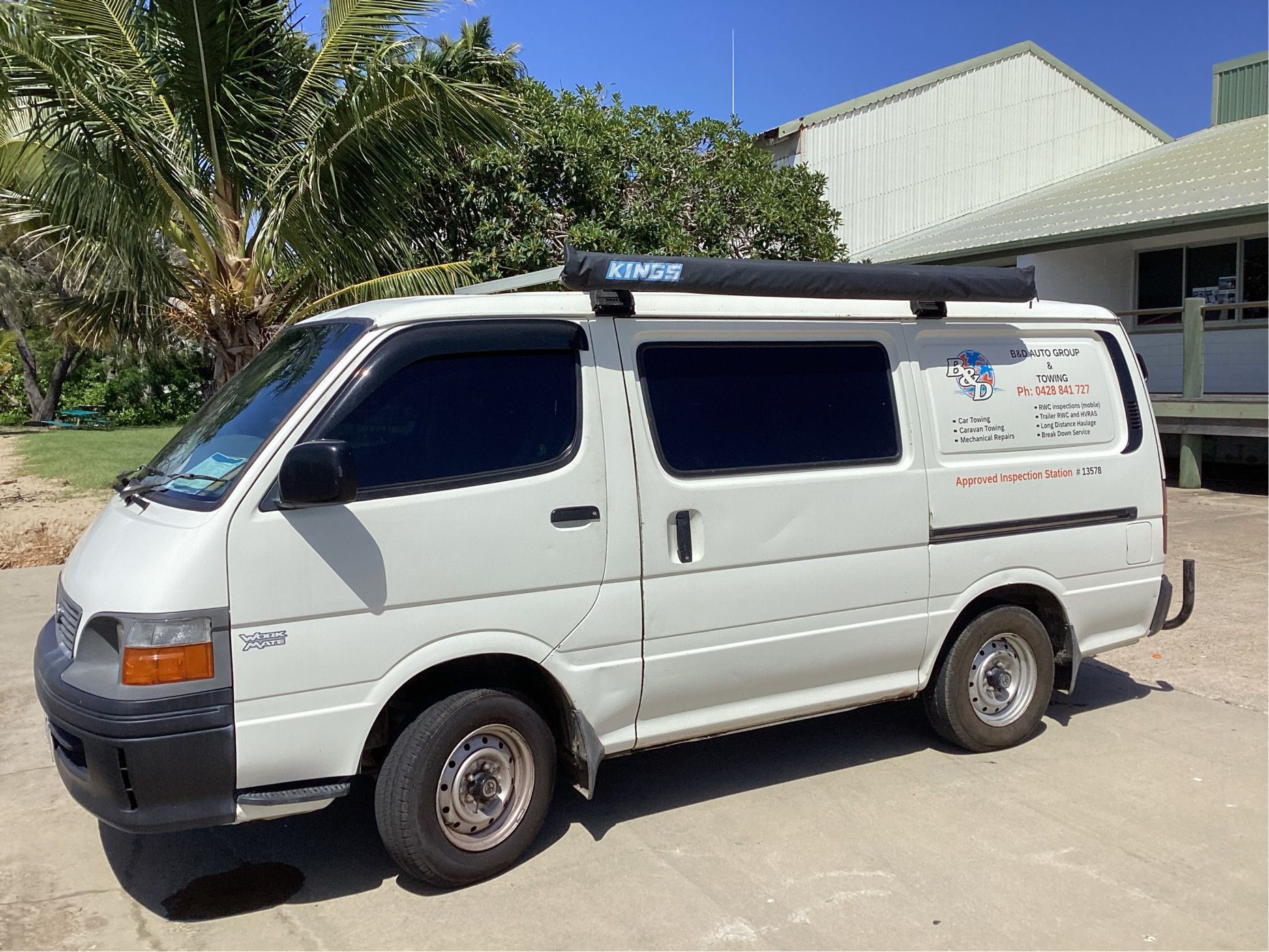 Mechanic Working on a Car's Brake Rotor, Hands on Parts, Workshop Setting — B&D Auto Group & Towing in Bowen, QLD