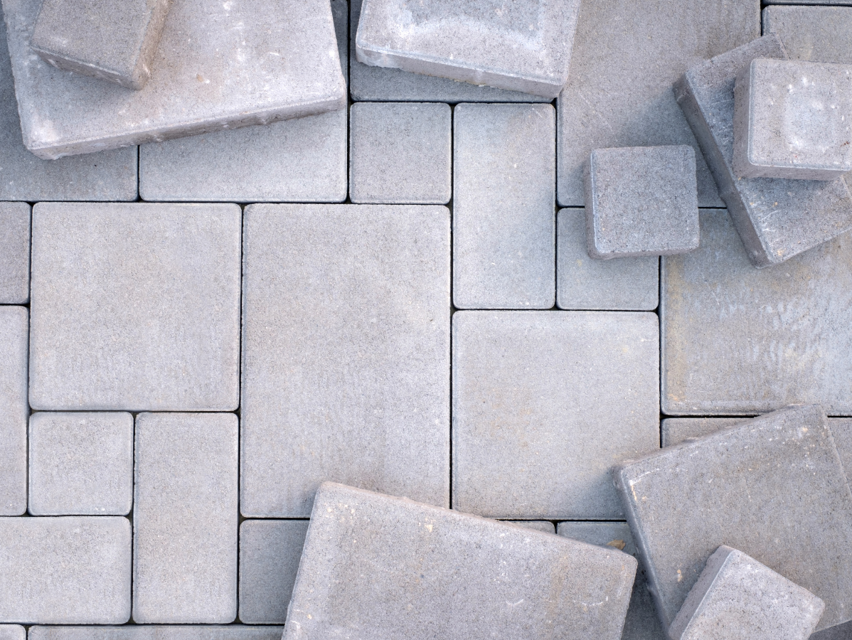 Abstract arrangement of pale gray rectangular blocks and cubes with subtle shadows
