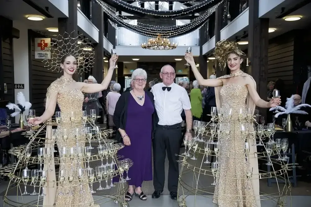 Residents posing at themed celebration event