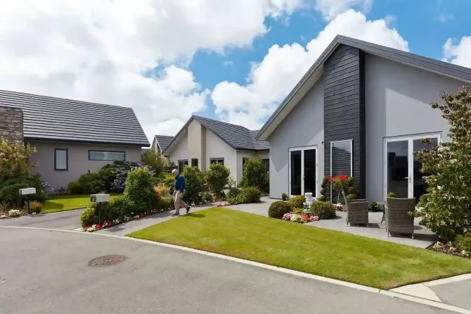 Resident walking through landscaped villas