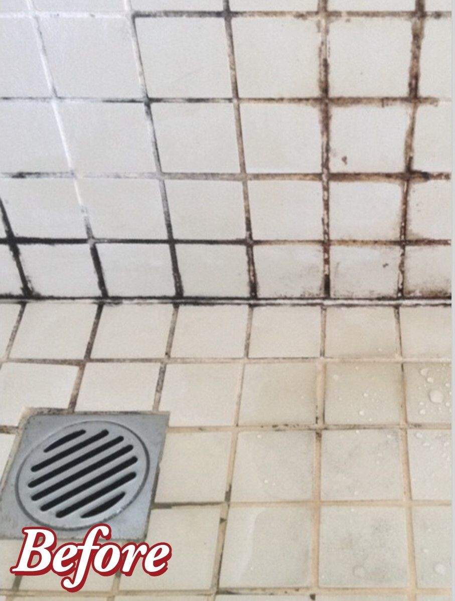 Accessible shower with built-in bench, grab bar, multiple shower heads, and tiled walls/floor.