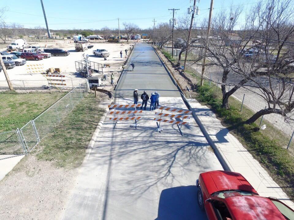 Couple Of Man Standing At The Middle Of Roadway - Eagle Pass, TX - A.E. Hiller & Sons Inc.