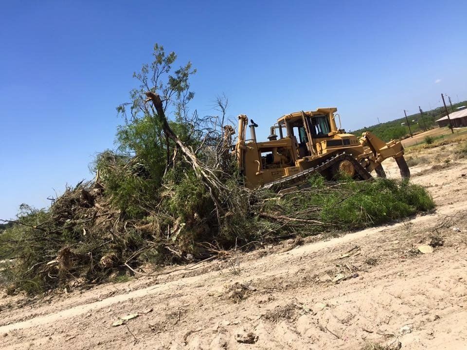 Bulldozer Pushing Trees - Eagle Pass, TX - A.E. Hiller & Sons Inc.