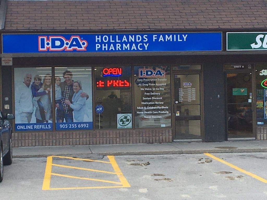 Ida hollands family pharmacy is located in a brick building
