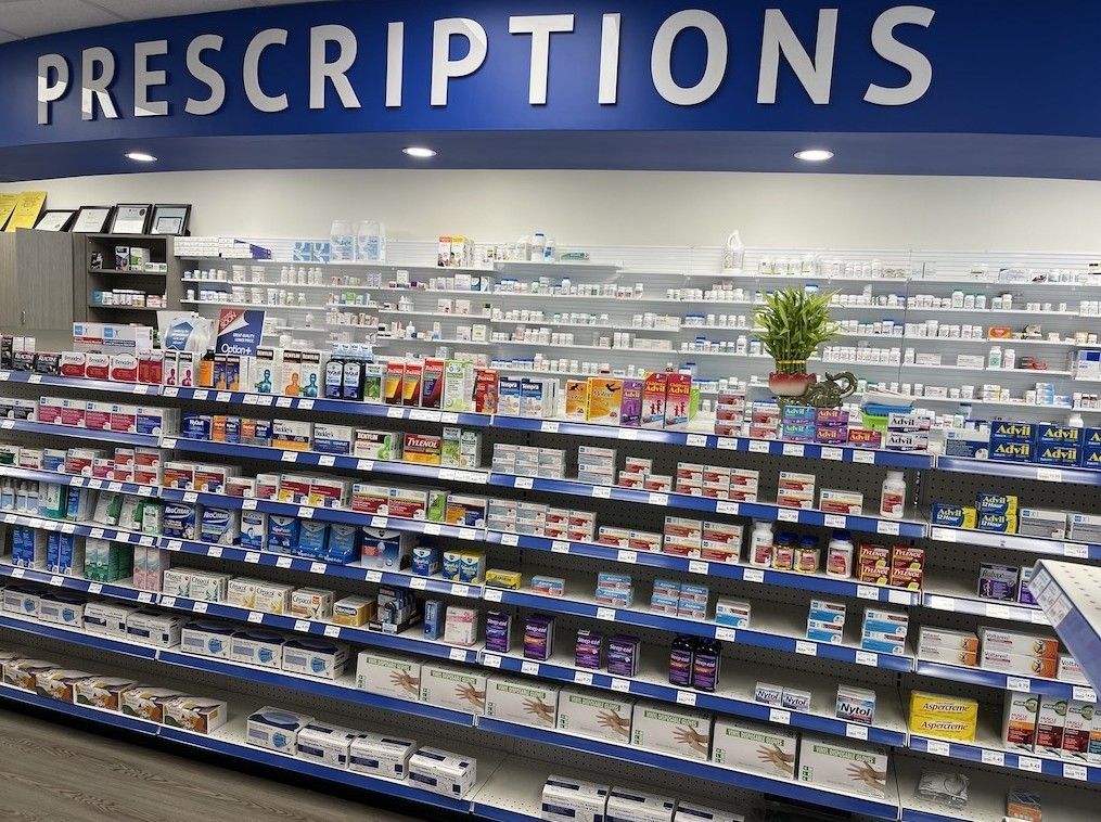 A pharmacy with a sign that says prescriptions on it