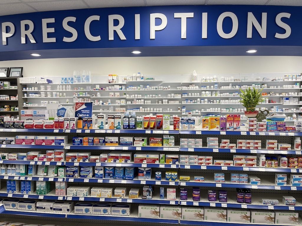A pharmacy with a sign that says prescriptions