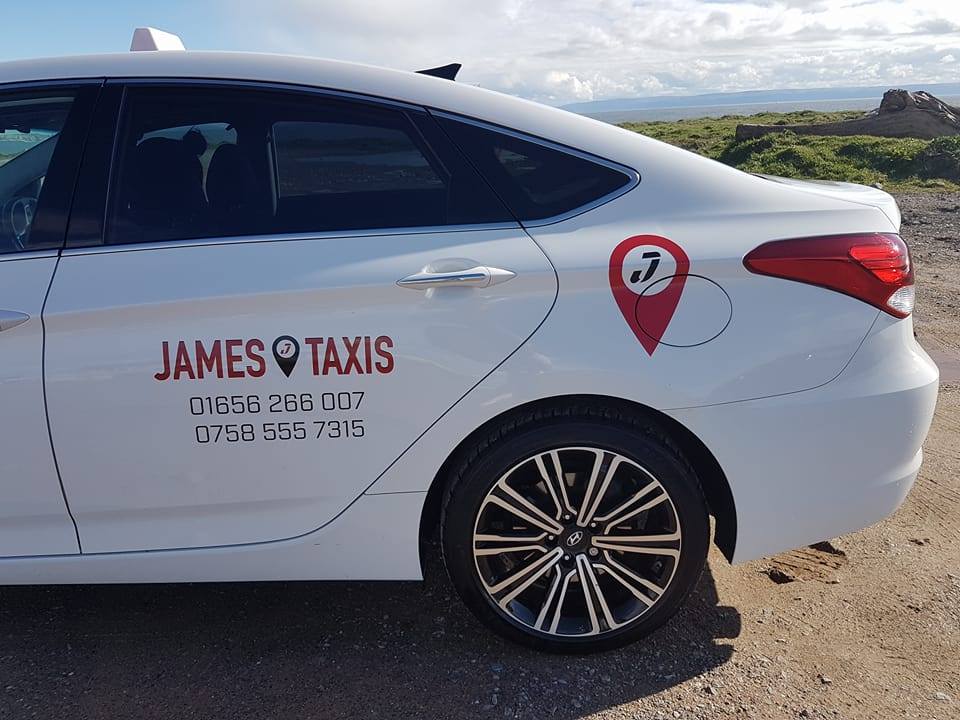 James Taxi logo on white car