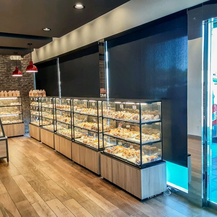 A bakery with a lot of displays of food