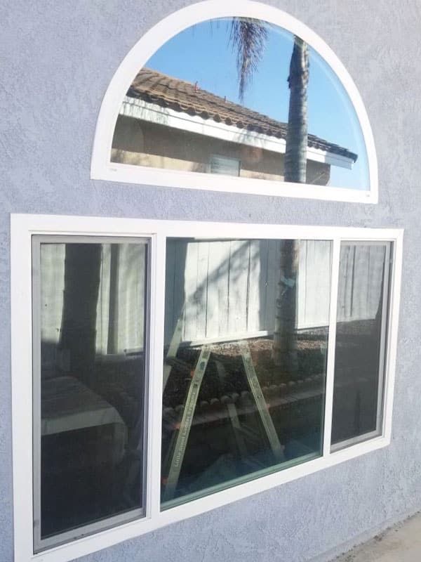 A large window on the side of a house